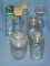 Collection of vintage glass covered storage jars
