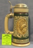 Vintage porcelain beer stein with hunting and fishing theme