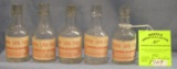 Group of five early poison bottles