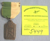 Early policeman’s handgun award medal and ribbon
