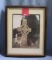 Matted and framed religious photo