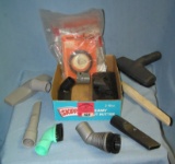 Box full of vacuum cleaner parts and accessories