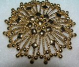 High quality gold toned pin signed Monet