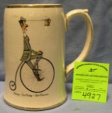 Early Penny Farthing high wheel bicycle advertising beer mug
