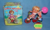 All tin windup Girl on Tricycle toy