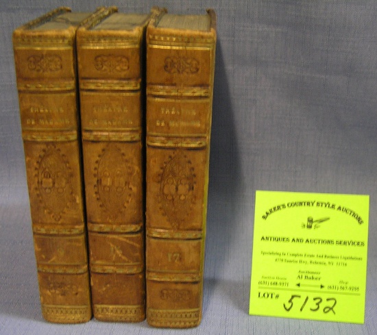 Group of three antique leather bound books