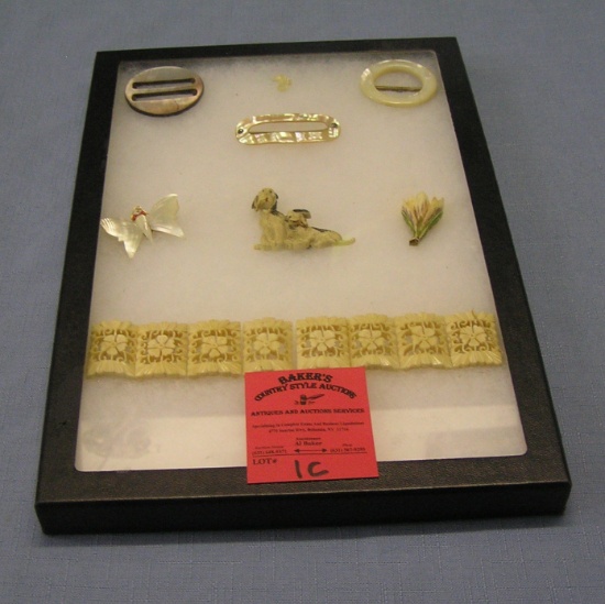 Collection of vintage jewelry pins and buckles