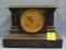 Antique cast iron mantle clock with gold trim