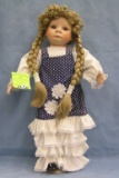 Vintage porcelain doll with pig tails