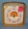 Box of vintage 45 RPM records