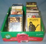 Box full of vintage musical cassette tapes