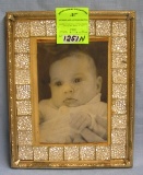Vintage baby photo in decorative frame