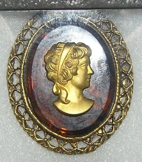 Cameo style pin on amnber colored Bakelite