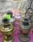 Group of four antique brass and copper oil lamps