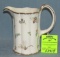 Vintage insect and flower decorated water pitcher