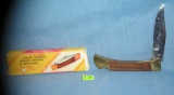 Brass and walnut pocket knife with original box