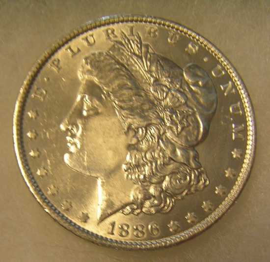 1886 Morgan silver dollar in AU condition
