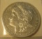 1878S Morgan silver dollar in AU condition