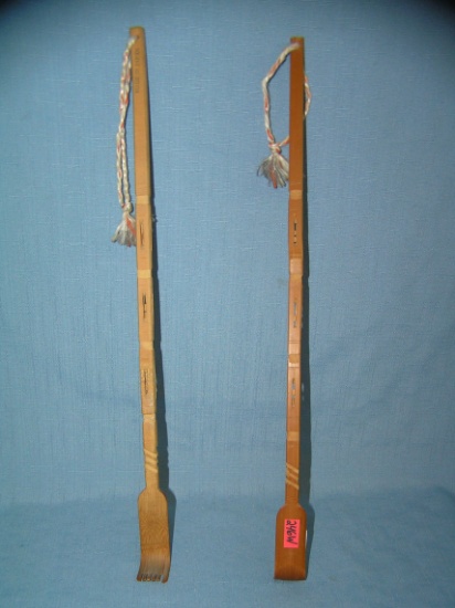 Pair of carved wooden souvenir back scratchers