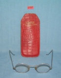 Antique eyeglasses with fancy silver style frames