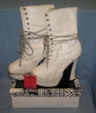Pair of white size 9 high top platform shoes