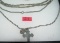 Pair of silver tone necklaces one with religious charms