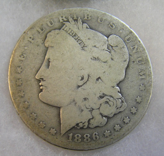 1886-O Morgan silver dollar in fair condition