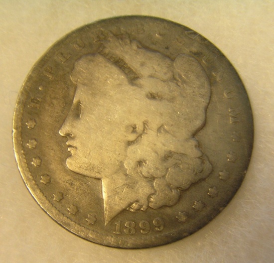 1899-0 Morgan silver dollar in poor condition