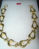 Gold tone and pearl necklace