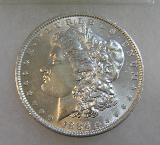 1886 Morgan silver dollar in AU condition