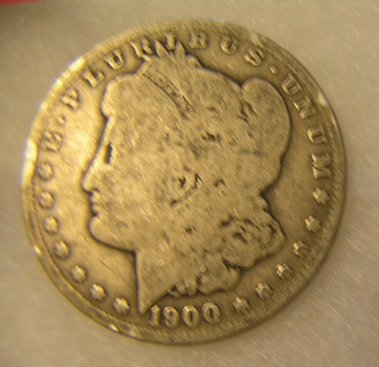 1900-O Morgan silver dollar in fair condition