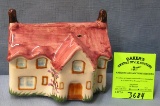 Painted porcelain cottage bank