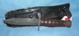 WWII fighting knife with post war sheath