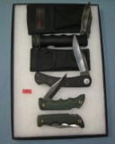 Collection of pocket and survival knives and cases