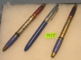 Group of three antique pens