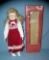 Red and white felt dressed collectible porcelain doll