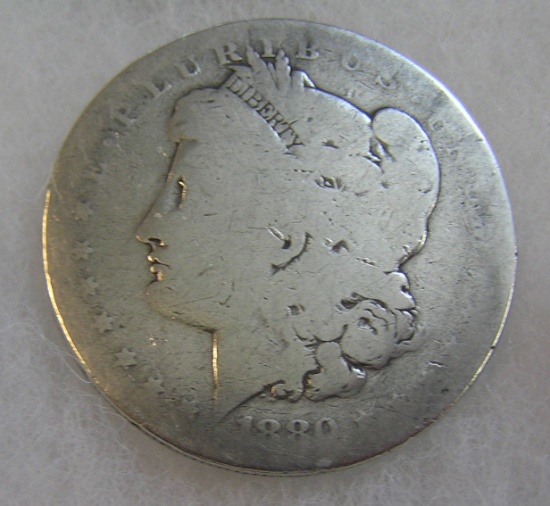 1880-O Morgan silver dollar in fair condition