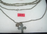 Pair of silver tone necklaces one with religious charms