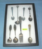 Collection of souvenir spoons and fork