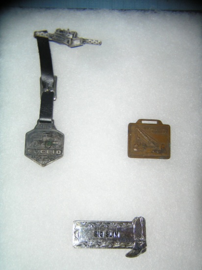 Group of vintage watch fobs and Western badge