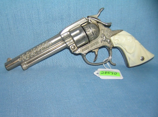 Vintage Gene Autry cast metal cap gun