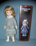 Blue and white dressed collectible porcelain doll in box
