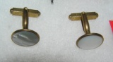 Pair of mother of pearl and gold toned cuff links