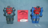 Pair of vintage Bandai transformer robot toys