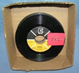 Box of vintage 45 RPM records