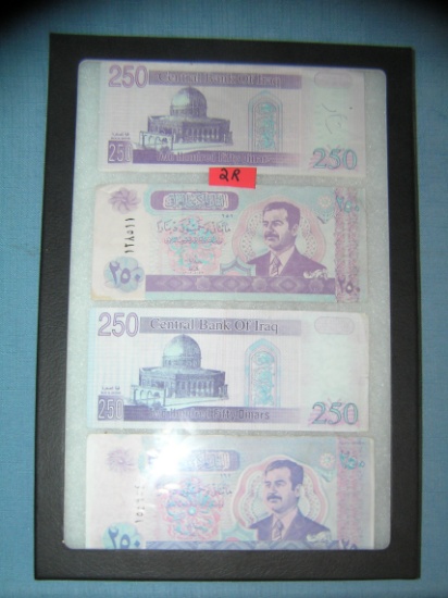 Iraqui currency featuring Saddam Hussien