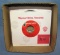 Box of vintage 45 RPM records