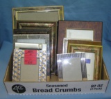 Box full of vintage and modern picture frames