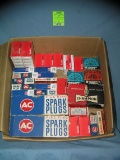 Box full of vintage muscle car parts