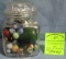 Glass jar full of marbles and wooden spinning top